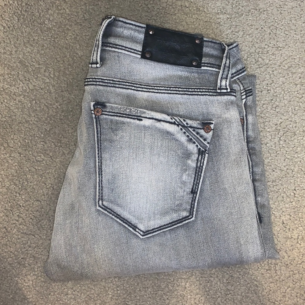 Grey buckle jeans